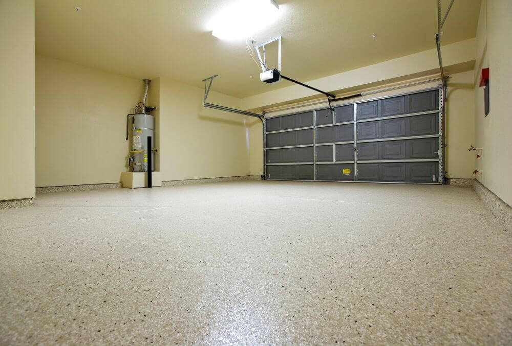 Empty cream colored garage with epoxy flooring